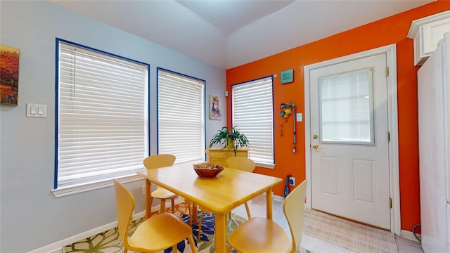 dining area featuring baseboards