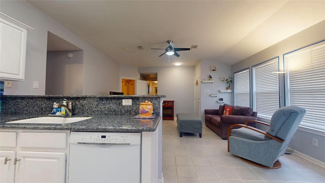 kitchen featuring white cabinets, open floor plan, a peninsula, white dishwasher, and a sink