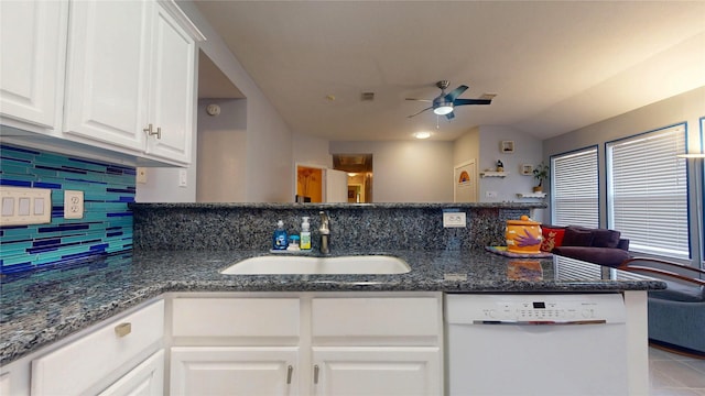 kitchen with white cabinetry, white dishwasher, a peninsula, and a sink