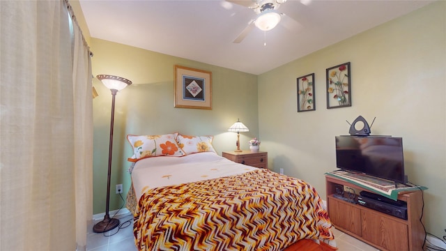 bedroom featuring a ceiling fan and tile patterned flooring