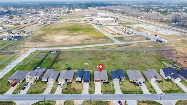 birds eye view of property with a residential view