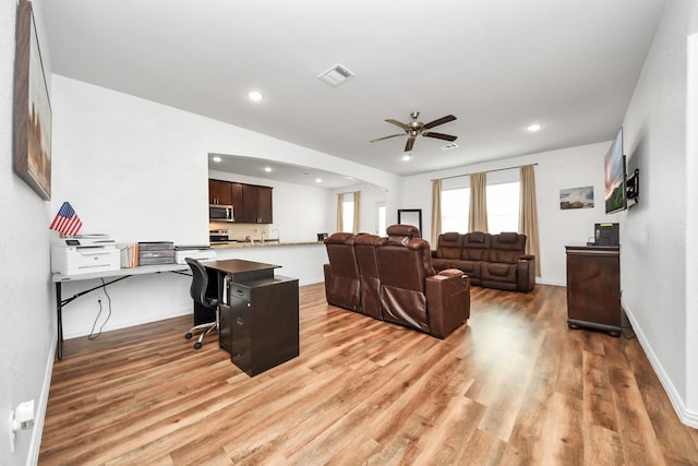 living room with visible vents, recessed lighting, light wood finished floors, baseboards, and ceiling fan