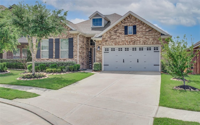 craftsman inspired home featuring an attached garage, brick siding, a shingled roof, concrete driveway, and a front lawn