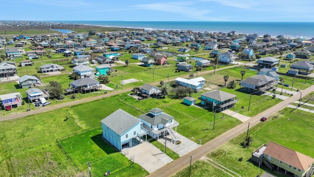 bird's eye view with a residential view and a water view