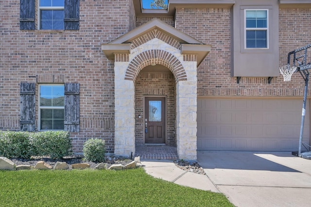 154 Meadow Grove Dr, Conroe, TX 77384 - entrance to property featuring brick siding, driveway, and an attached garage
