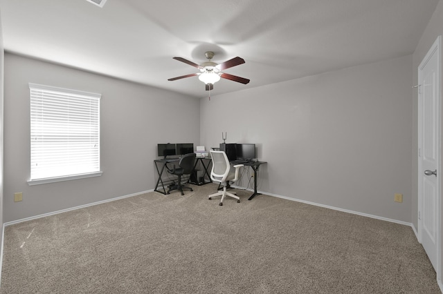 office space featuring baseboards, carpet floors, and ceiling fan