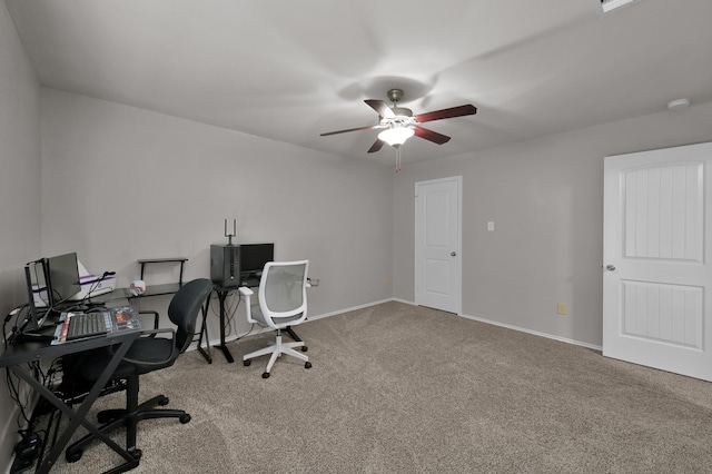 carpeted home office featuring baseboards