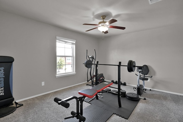 exercise area with a ceiling fan, baseboards, and carpet floors