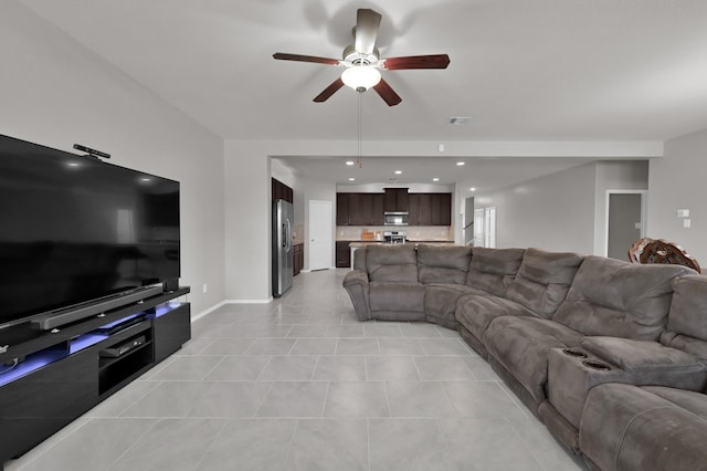 living area with light tile patterned floors, a ceiling fan, visible vents, baseboards, and recessed lighting