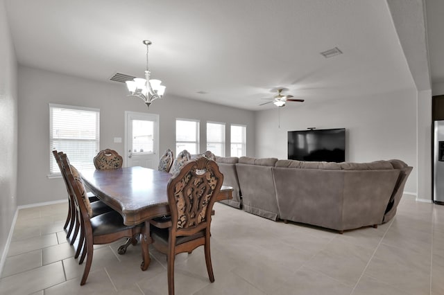 dining space with light tile patterned floors, visible vents, and baseboards