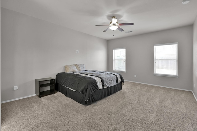 bedroom with carpet flooring, baseboards, and visible vents