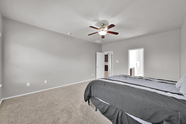 bedroom with a ceiling fan, baseboards, and carpet floors