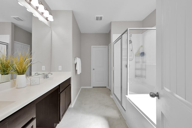 bathroom featuring a sink, visible vents, and a shower stall