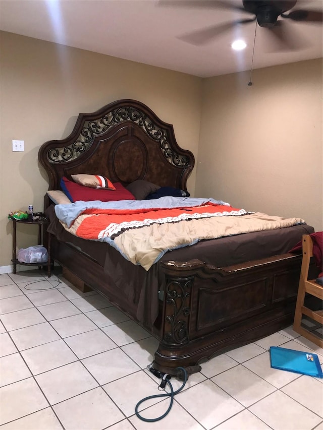 bedroom with light tile patterned floors and ceiling fan