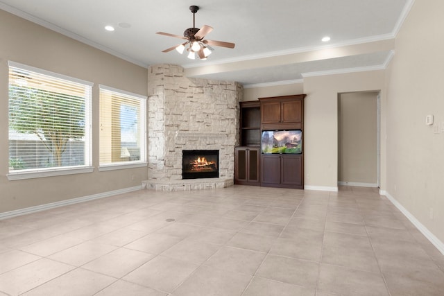 unfurnished living room featuring crown molding, light tile patterned floors, baseboards, and ceiling fan