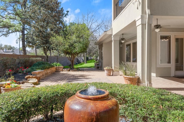 view of yard with ceiling fan, a patio, and fence