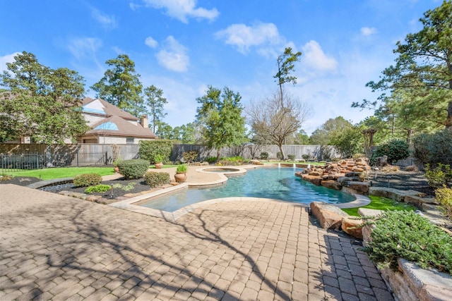 view of pool featuring a fenced in pool, a patio, an in ground hot tub, and a fenced backyard