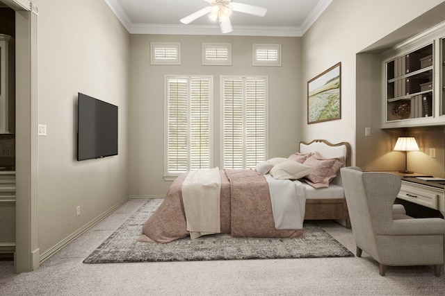 bedroom featuring crown molding, a ceiling fan, and baseboards