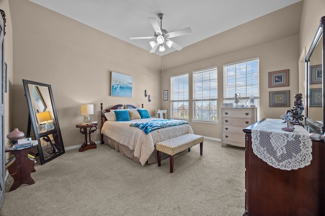 carpeted bedroom featuring ceiling fan and baseboards