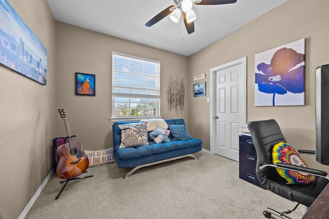 carpeted home office featuring a ceiling fan and baseboards