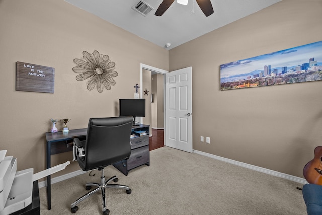 office area with a ceiling fan, baseboards, visible vents, and carpet flooring