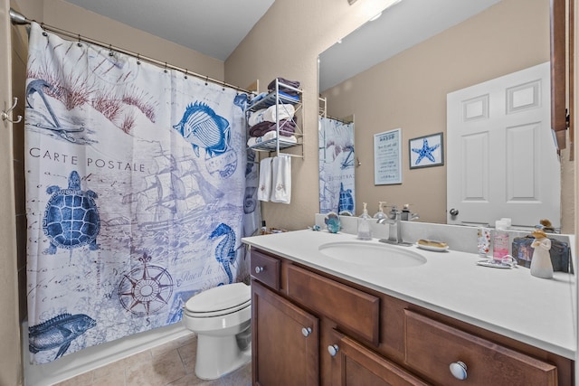 bathroom with toilet, tile patterned flooring, and vanity