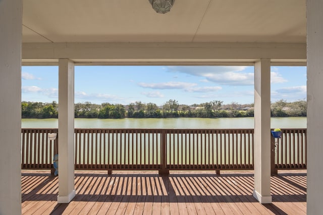 dock area featuring a deck with water view