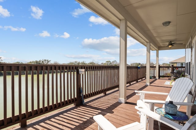 wooden deck featuring a ceiling fan