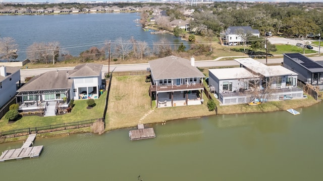 bird's eye view featuring a water view and a residential view