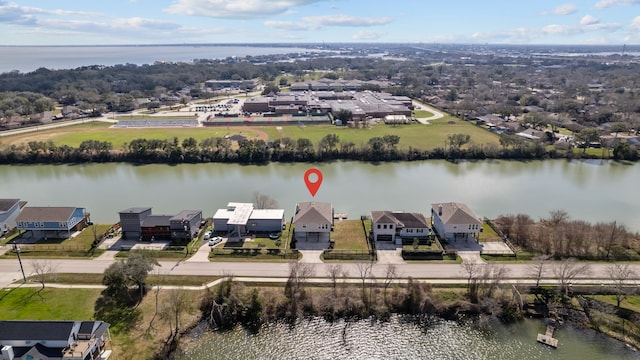 birds eye view of property featuring a water view