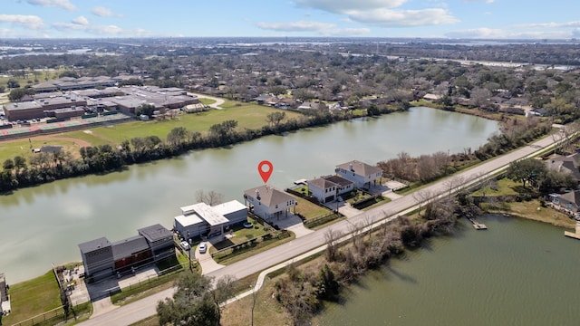 drone / aerial view with a water view and a residential view