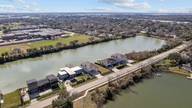 drone / aerial view featuring a water view and a residential view