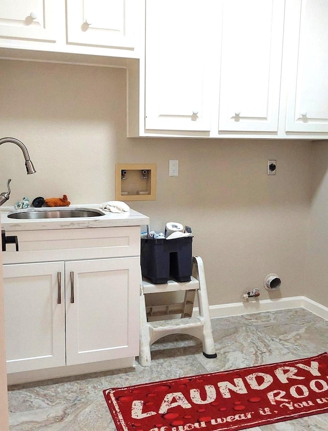 washroom with hookup for an electric dryer, cabinet space, a sink, washer hookup, and marble finish floor