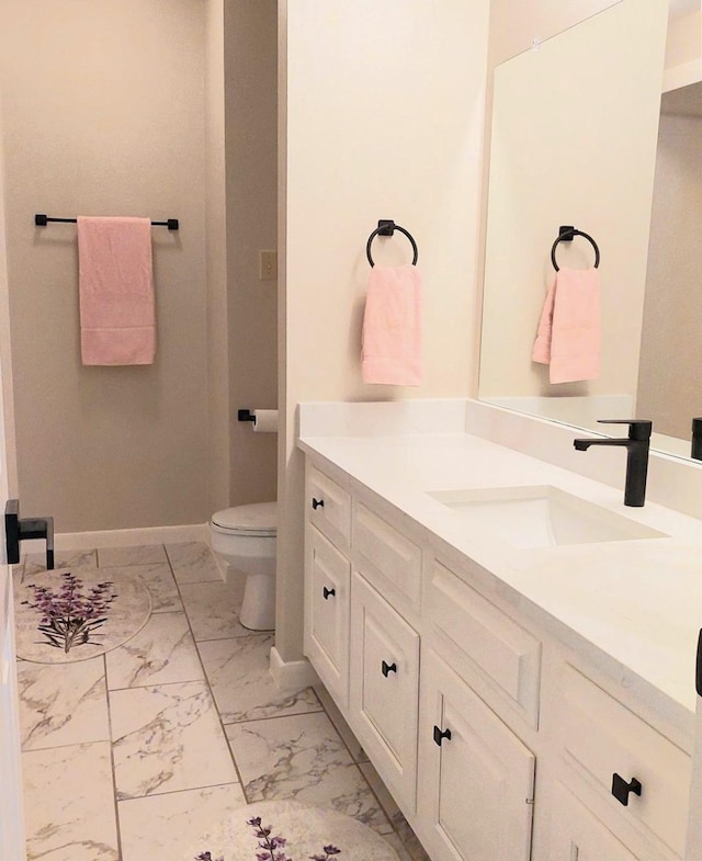 5523 Fragrant Cloud Ct, Houston, TX 77041 - bathroom featuring marble finish flooring, baseboards, toilet, and vanity