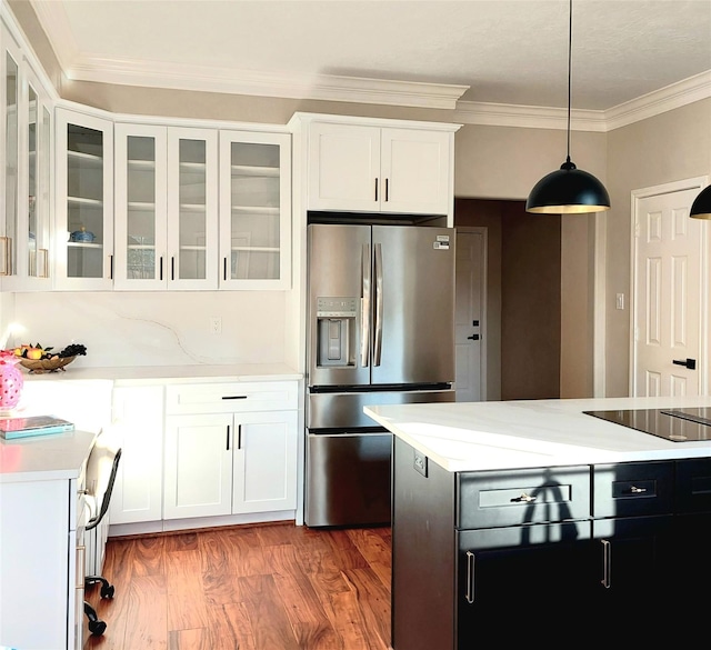 5523 Fragrant Cloud Ct, Houston, TX 77041 - kitchen with stainless steel fridge, black electric stovetop, light countertops, wood finished floors, and white cabinetry