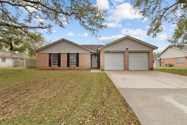 ranch-style home featuring a front yard, cooling unit, driveway, an attached garage, and brick siding