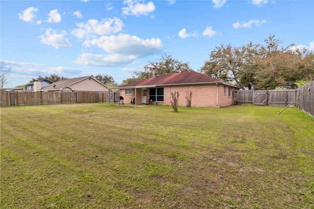 view of yard with a fenced backyard