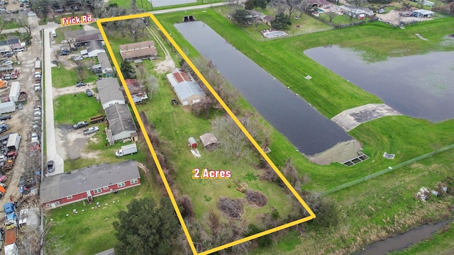 aerial view with a water view and a residential view