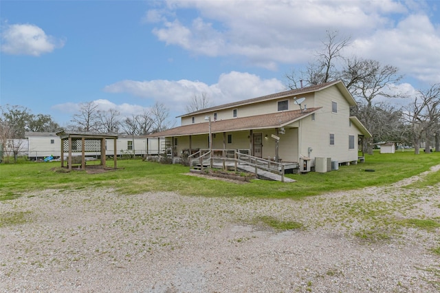 view of front of property featuring central AC and roof with shingles