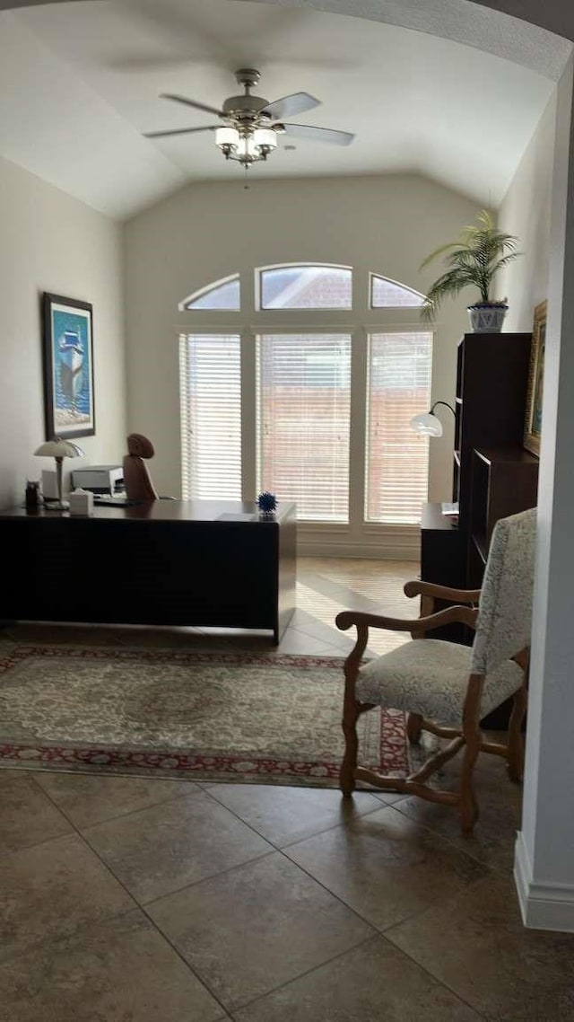 office with a ceiling fan, tile patterned flooring, a healthy amount of sunlight, and vaulted ceiling