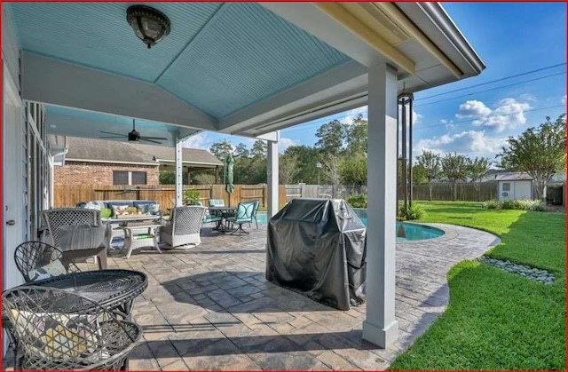 view of patio with a fenced in pool, area for grilling, an outdoor hangout area, outdoor dining space, and a fenced backyard