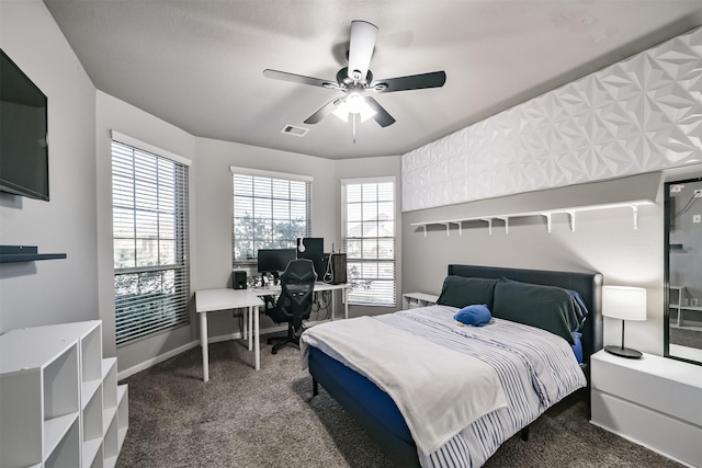 bedroom featuring baseboards, multiple windows, visible vents, and carpet flooring