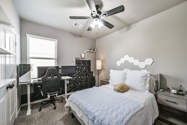 carpeted bedroom with visible vents and ceiling fan