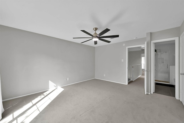 unfurnished bedroom featuring ceiling fan, carpet flooring, and baseboards