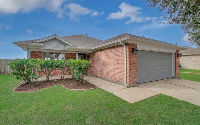 ranch-style home with a shingled roof, concrete driveway, an attached garage, a front lawn, and brick siding