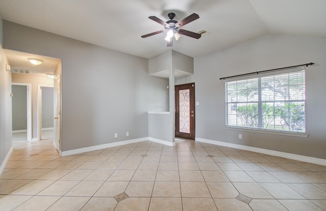 interior space with light tile patterned floors, baseboards, visible vents, and a ceiling fan