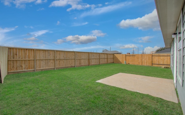 view of yard featuring a fenced backyard and a patio