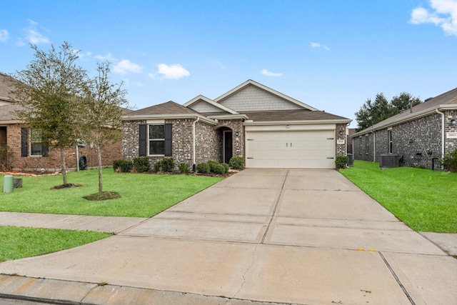 view of front of house with brick siding, an attached garage, central AC, driveway, and a front lawn