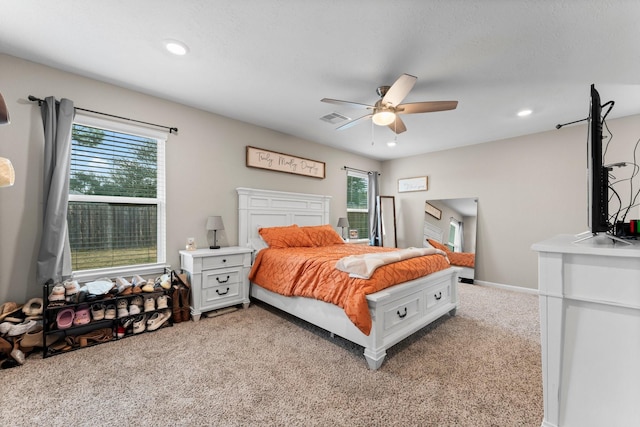 carpeted bedroom with baseboards, visible vents, ceiling fan, and recessed lighting