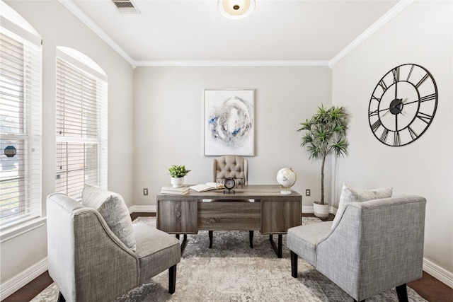 home office with baseboards, visible vents, wood finished floors, and ornamental molding